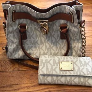 Beautiful Micheal Kors bag and check book wallet